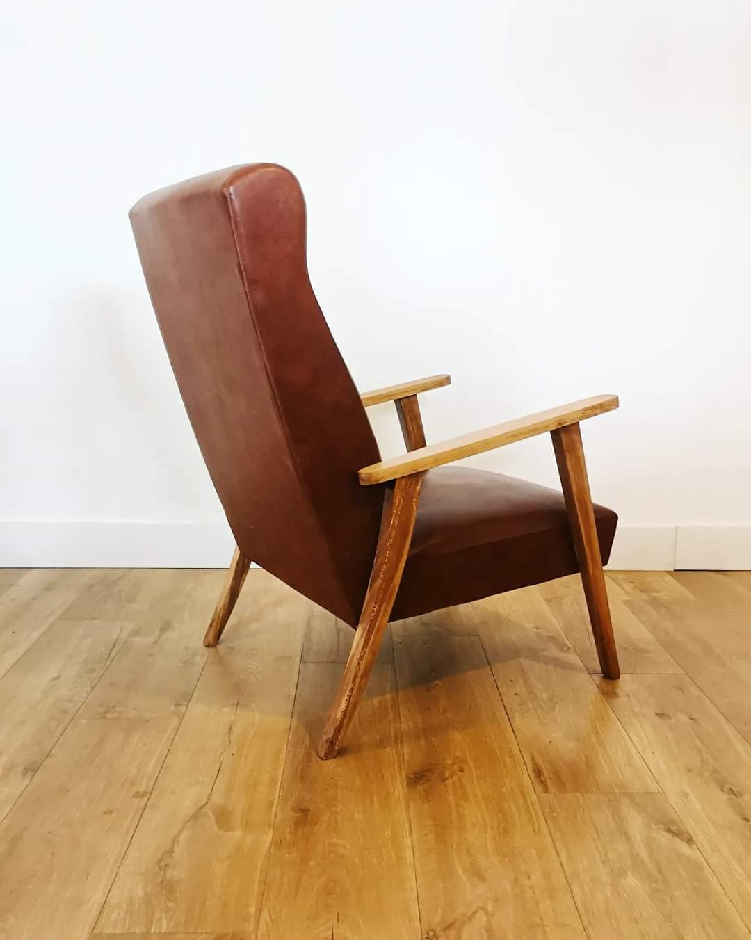 70 armchair in brown skai and wooden structure