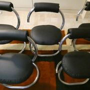 Cobra chairs in steel and black leather by Giotto Stoppino, 1970s, set of 5.