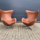 2 vintage Fritz Hansen Egg Chairs in cognac leather, in like-new condition.