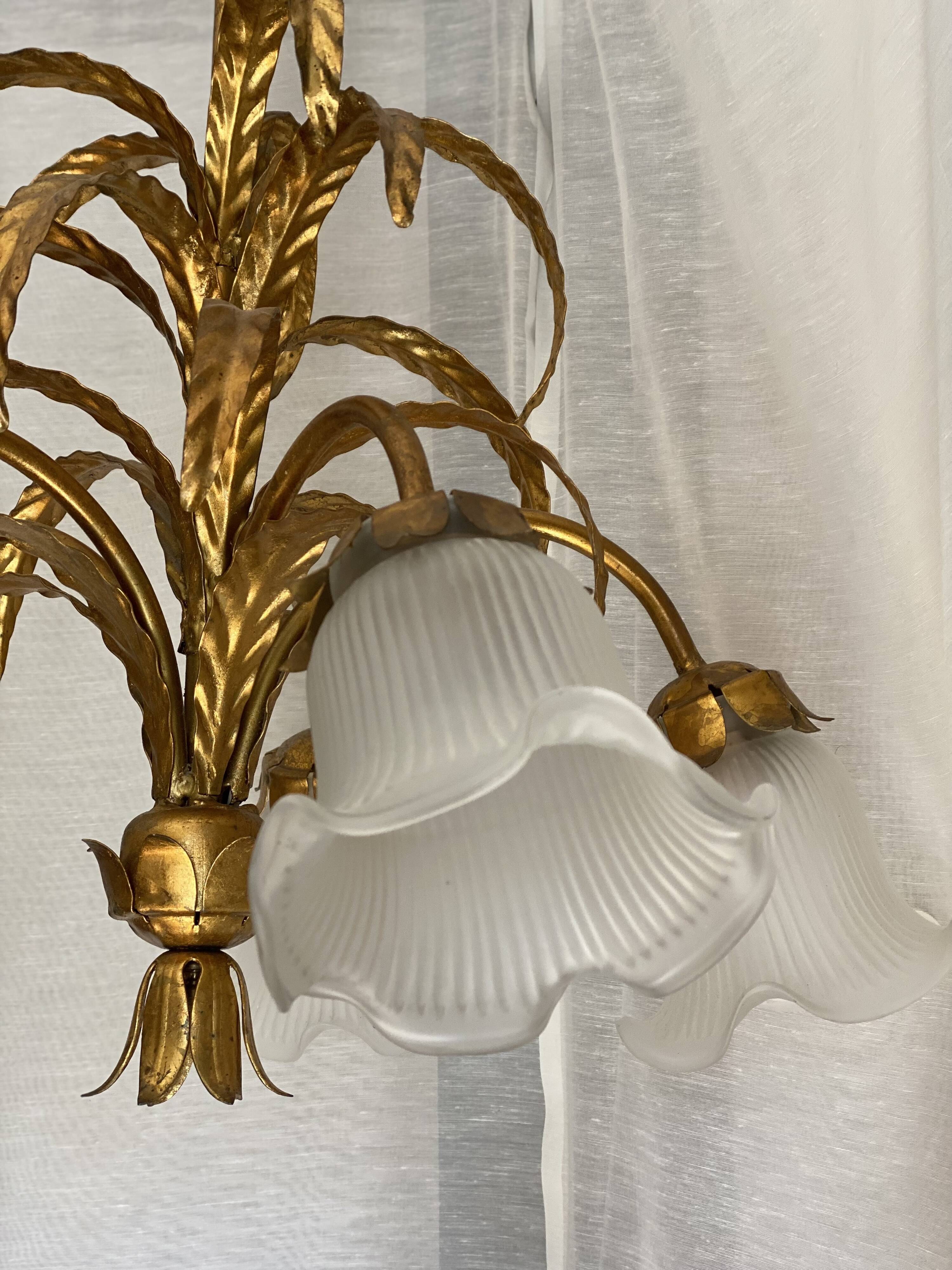 Vintage 1970s golden metal palm chandelier in the style of JANSEN.
