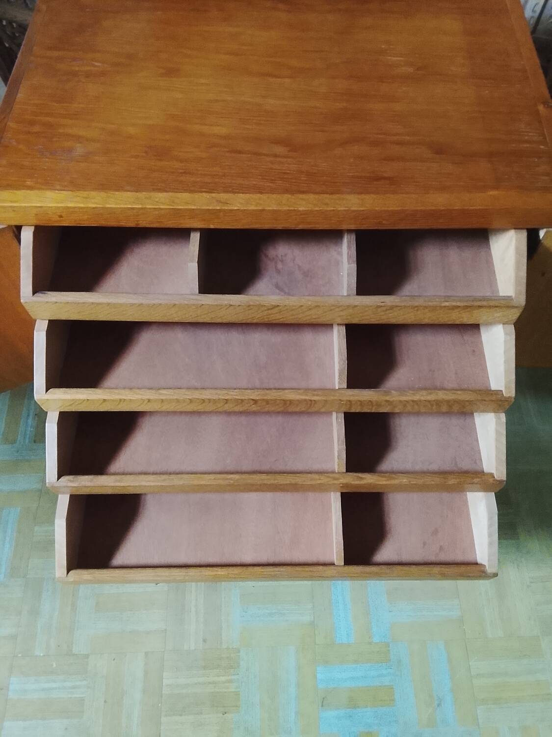 Vintage storage unit with two doors and four drawers.