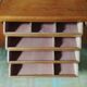Vintage storage unit with two doors and four drawers.