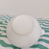 White porcelain teapot. Shiny stainless steel handle and lid