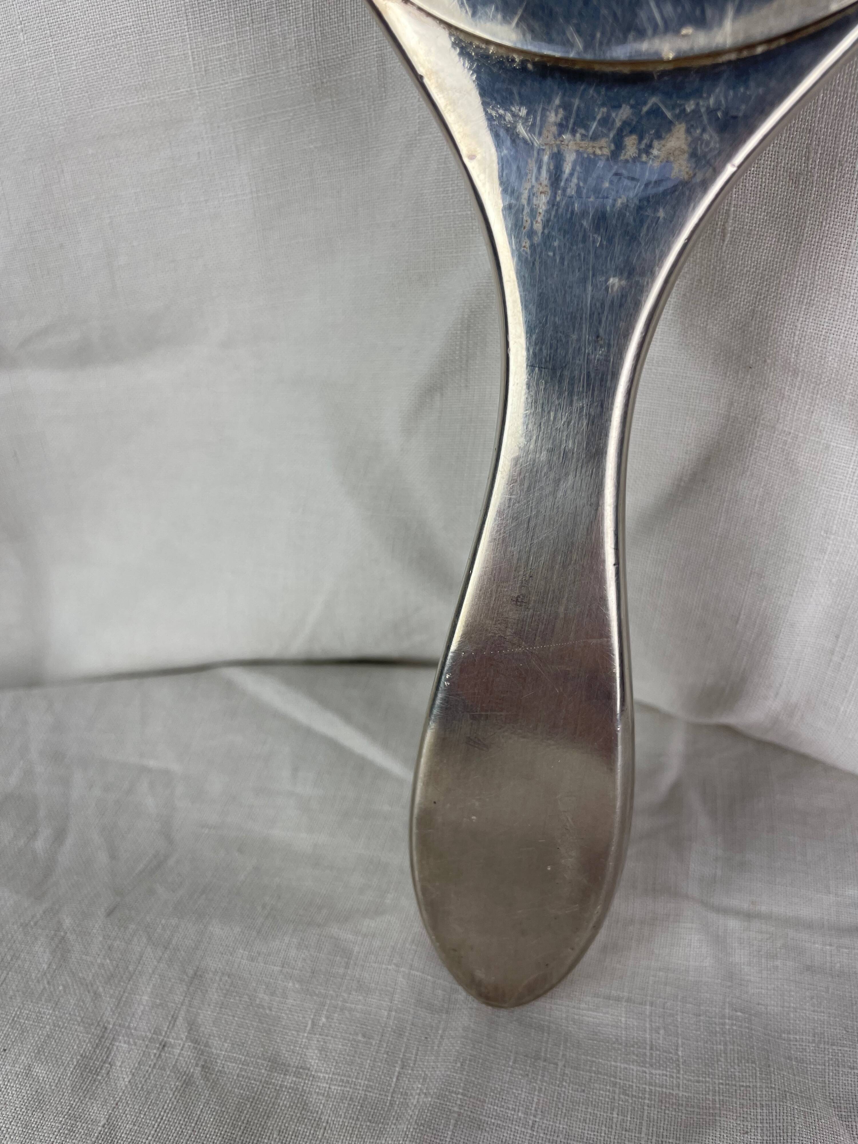 Silver metal hand mirror