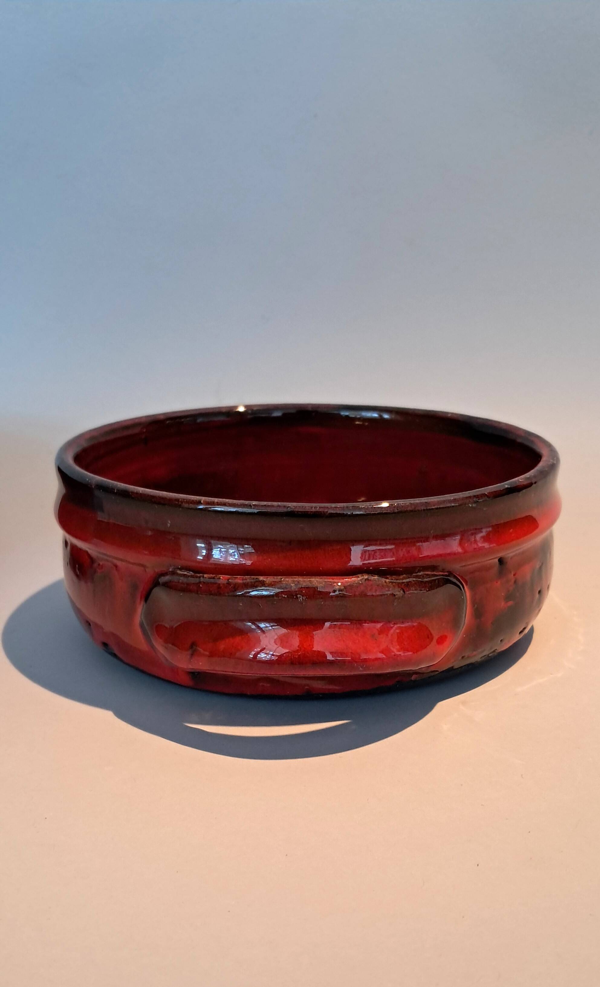 Red ceramic pieces by Gérard Hoffman (1917/1965).