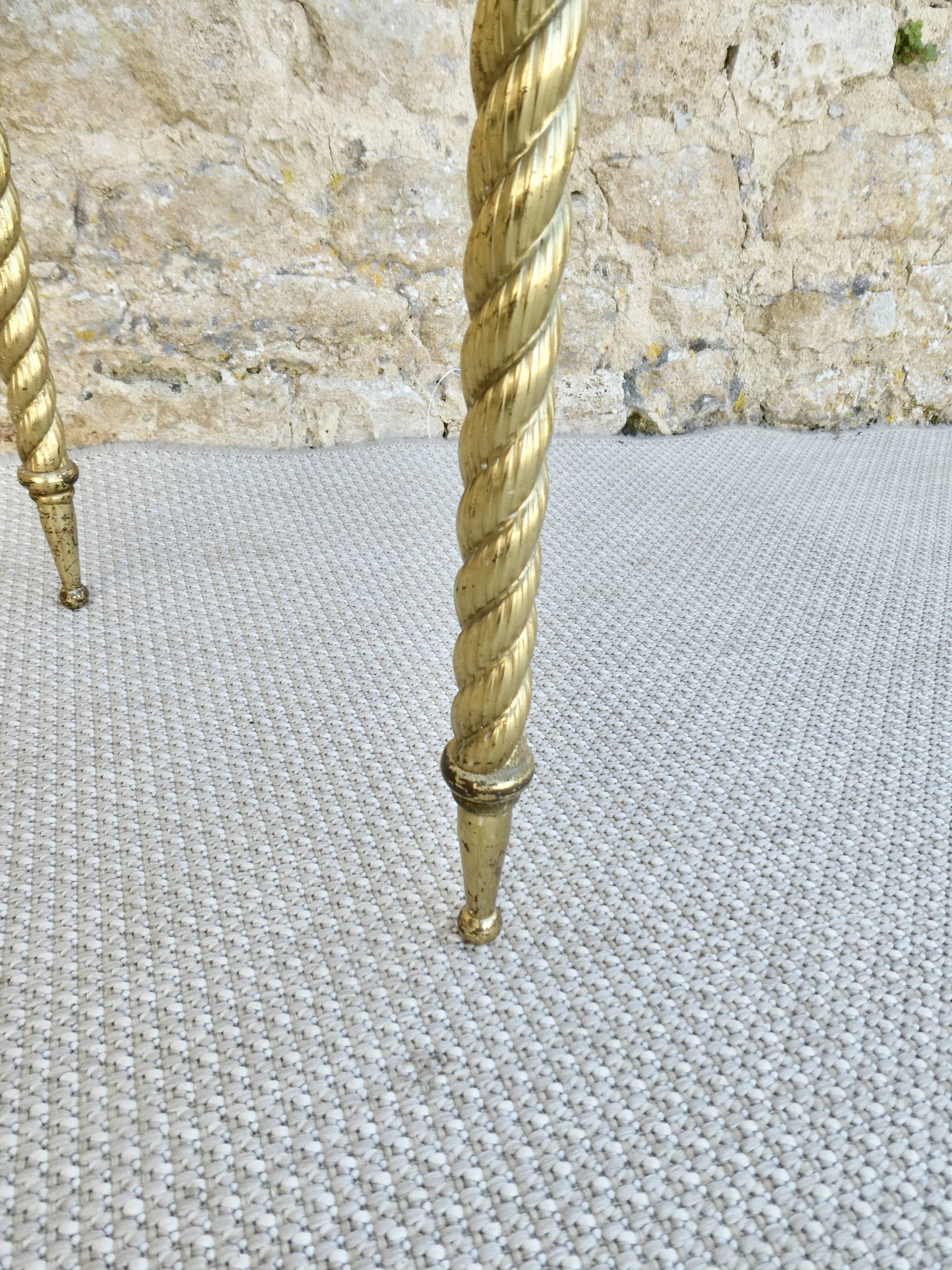 End of sofa, glass and twisted legs in gilded metal