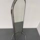 Large freestanding chrome metal full-length mirror in 1970s design.
