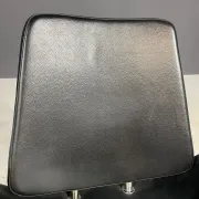 Alipes black swivel salon chair with chrome star base by Giorgetto Giugiaro for Gamma & Bross, Italy, contemporary, 85 × 70 × 60 cm