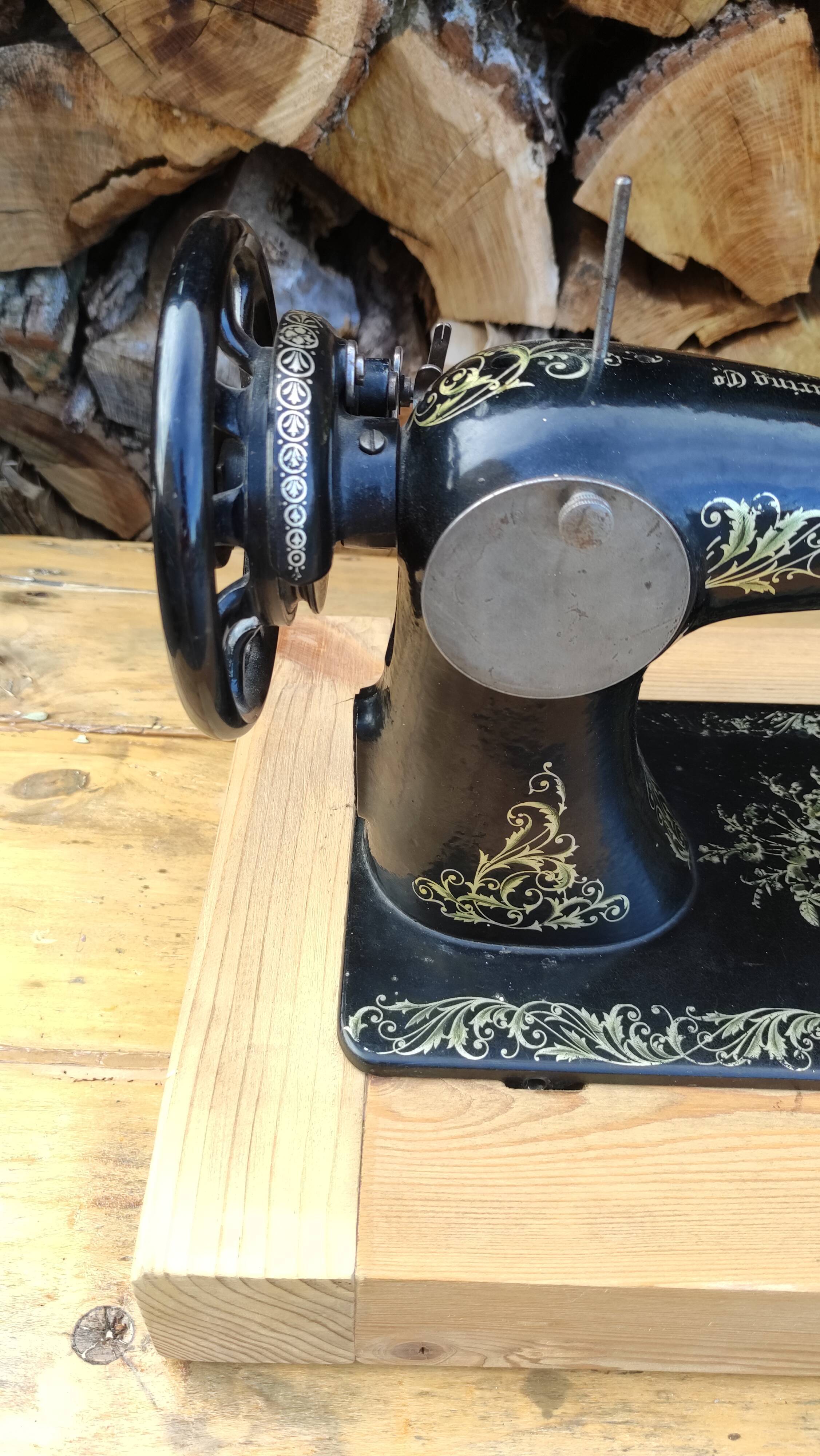 Old Singer sewing machine on pedestal