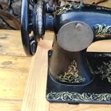 Old Singer sewing machine on pedestal