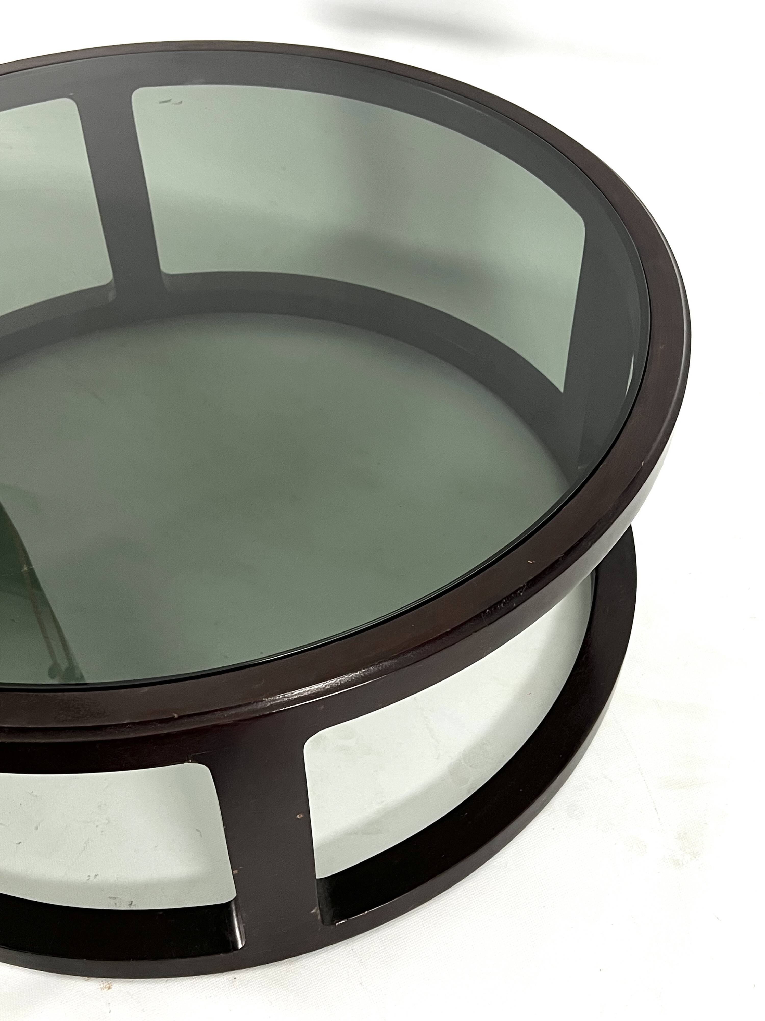 Italian Vintage Large Round coffee table in wood and fume glass. 1970s