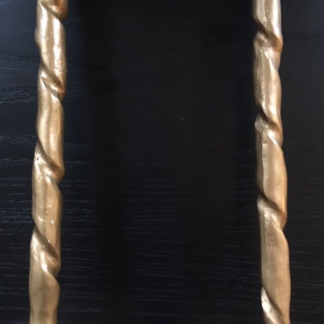 Pair of feet of golden lamps