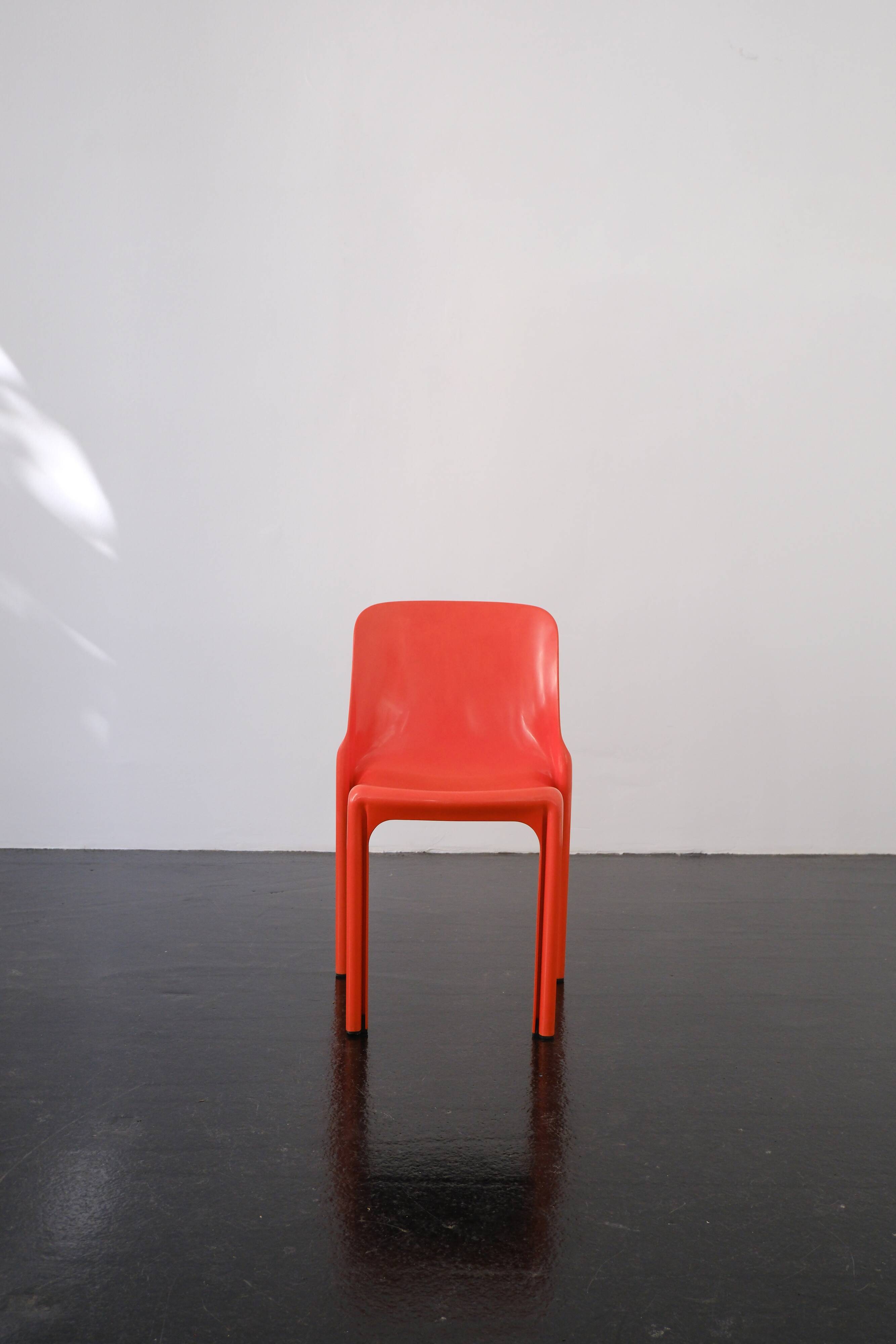 Orange "Selene" chair by Vico Magistretti / Artemide