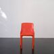 Orange "Selene" chair by Vico Magistretti / Artemide