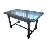 1960s Italian wooden table with a glass top.