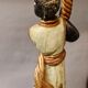 Nubian flare in wood and lacquered metal