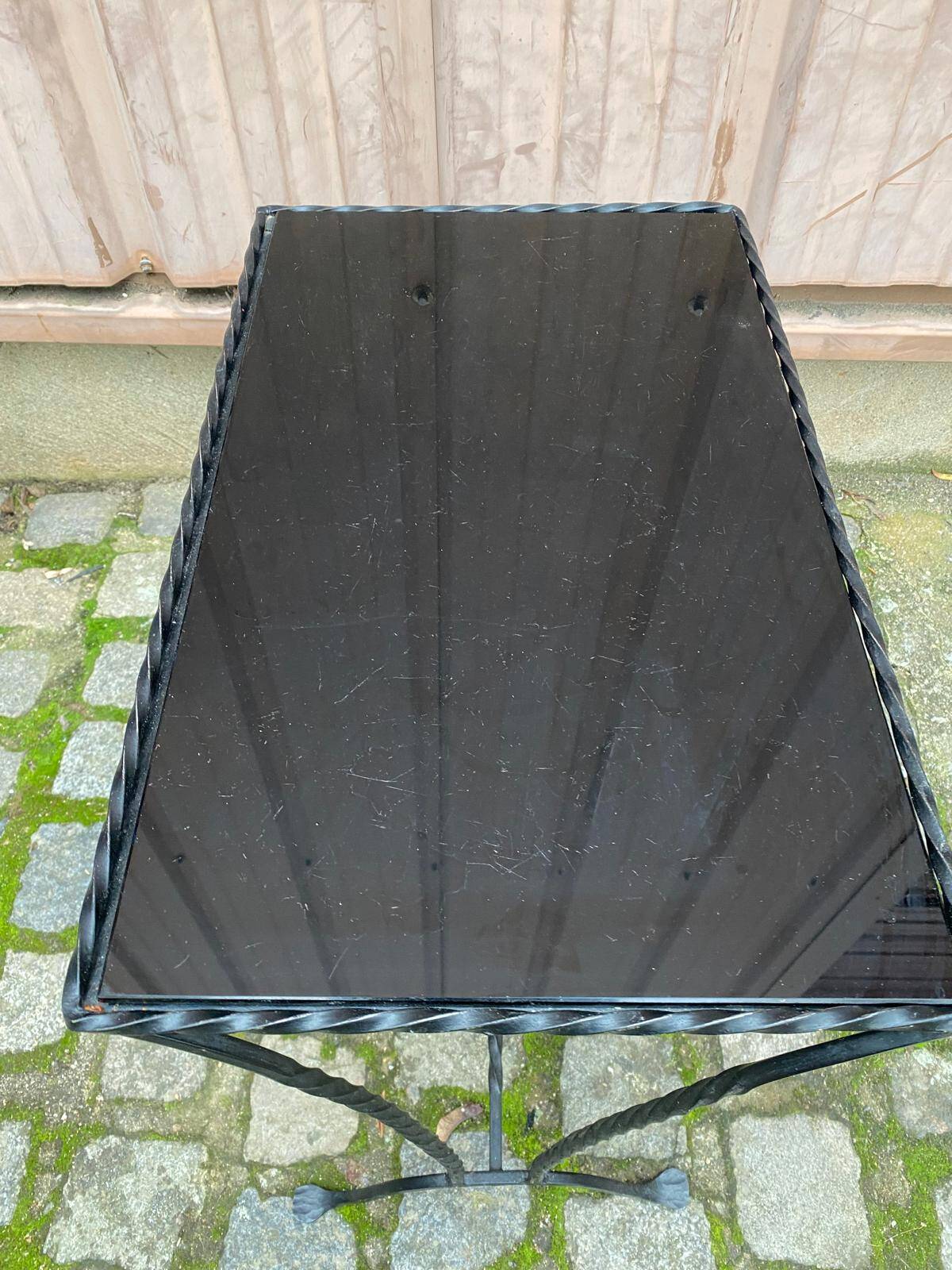 Coffee table/side table in the style of Jacques Adnet, made of steel and glass