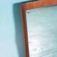 Minimalist Scandinavian mirror in teak with a vintage design.