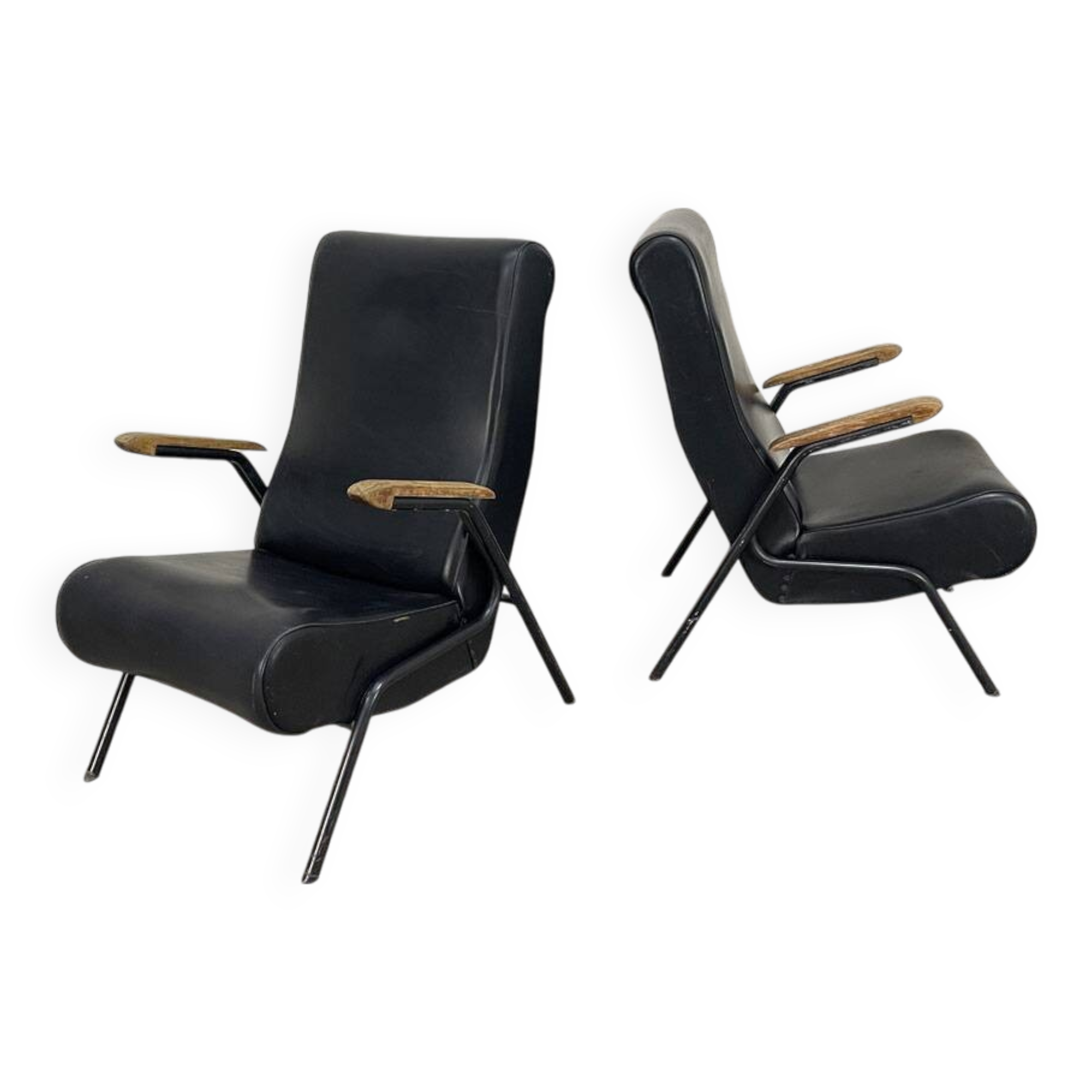 A pair of vintage armchairs in black faux leather.