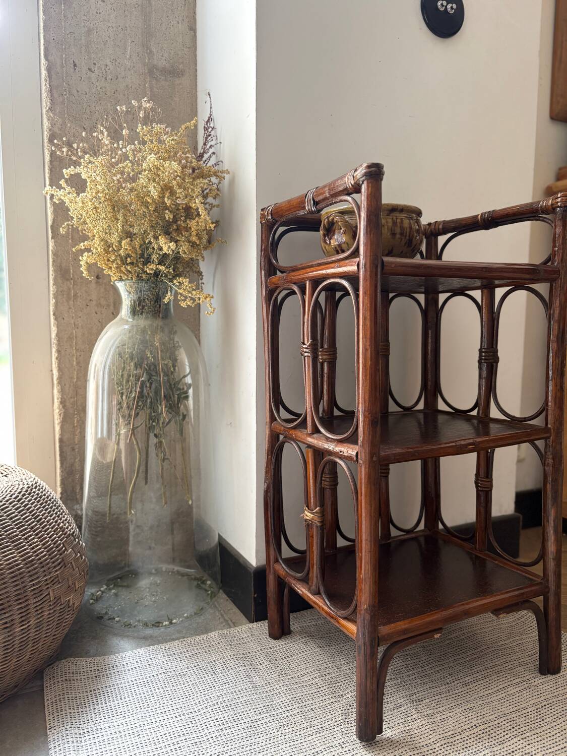 Dark brown 70s bamboo and cane shelf on legs
