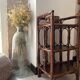 Dark brown 70s bamboo and cane shelf on legs