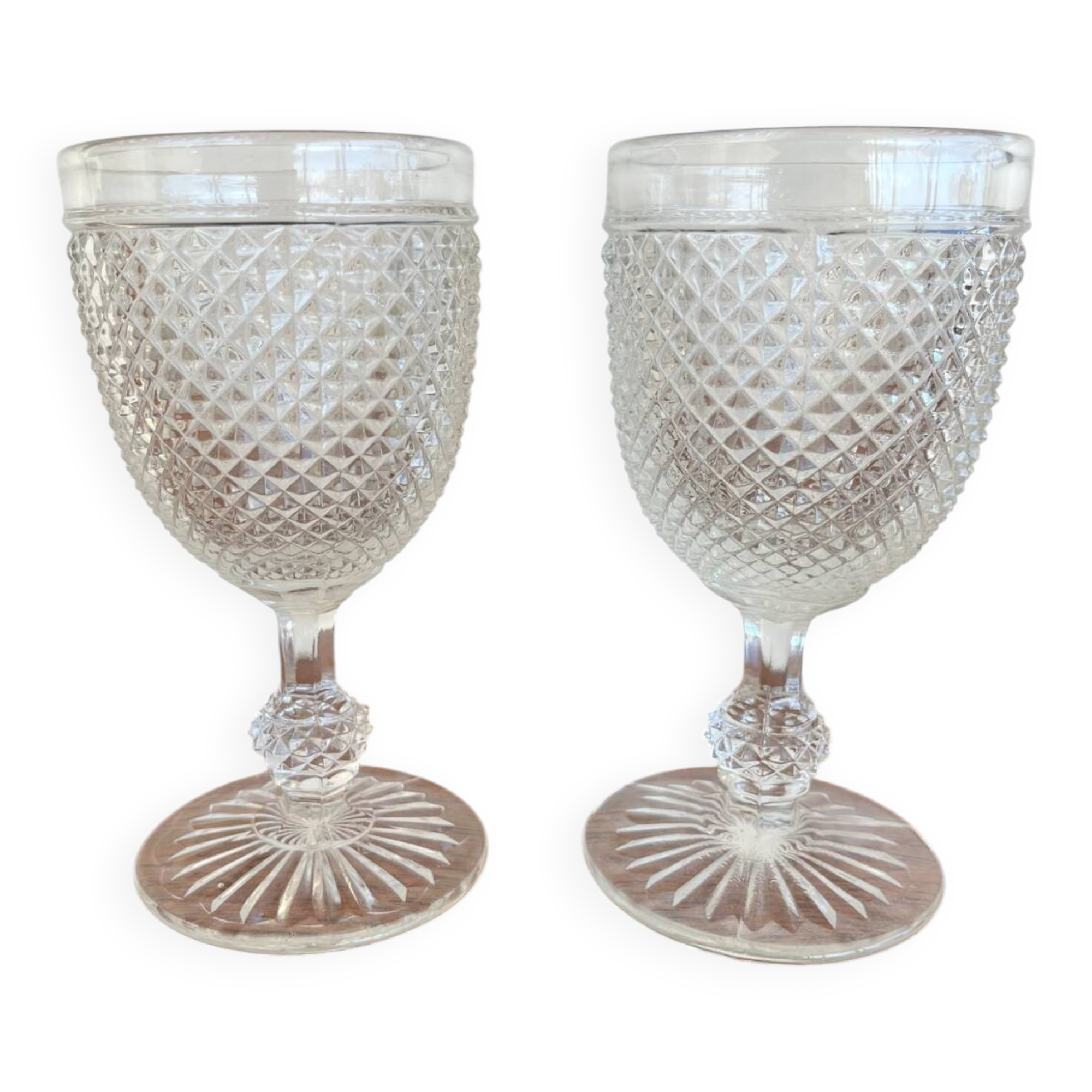 Two 19th-century moulded crystal glasses with diamond points.