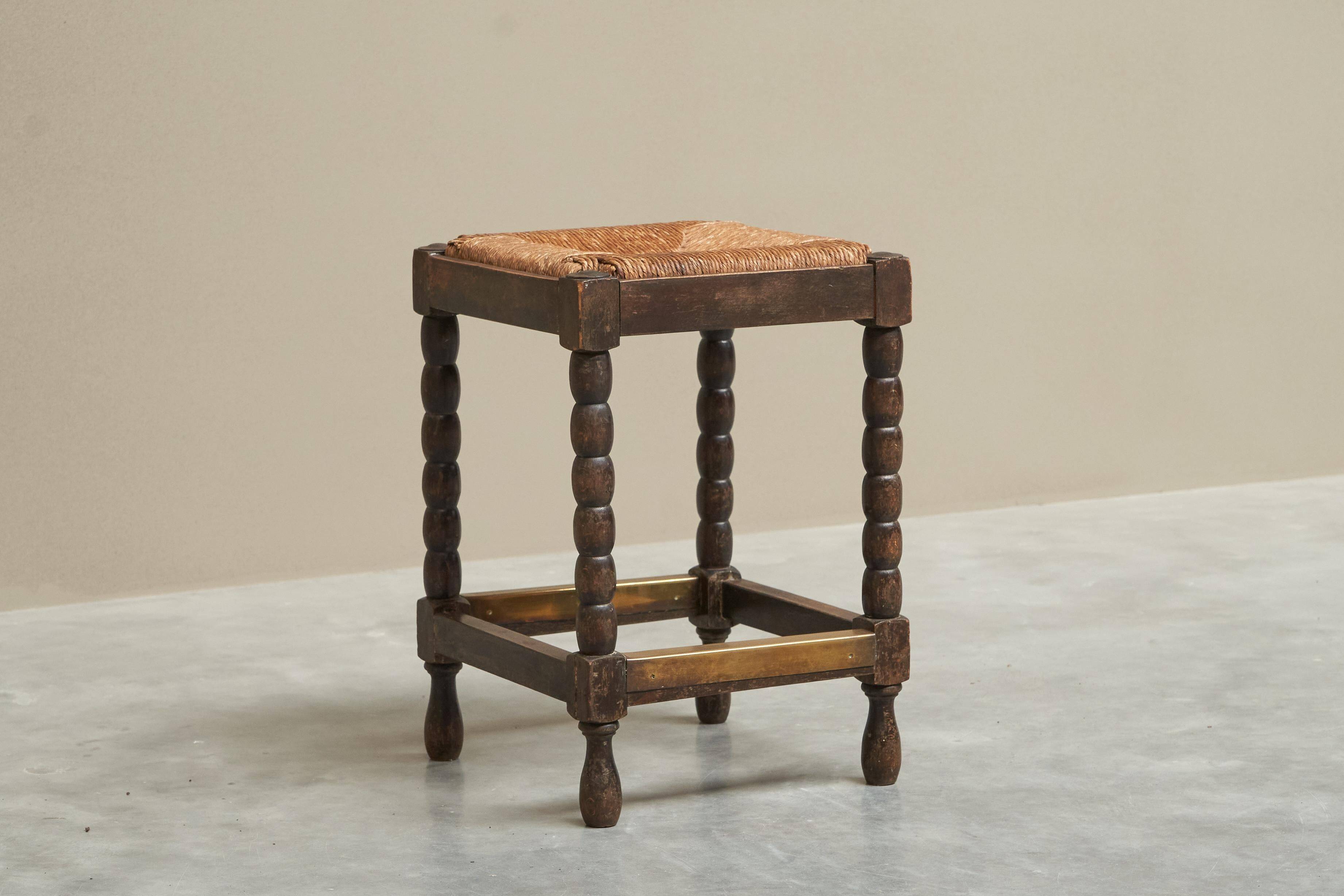 Solid oak stool, straw and brass from the 1920s.