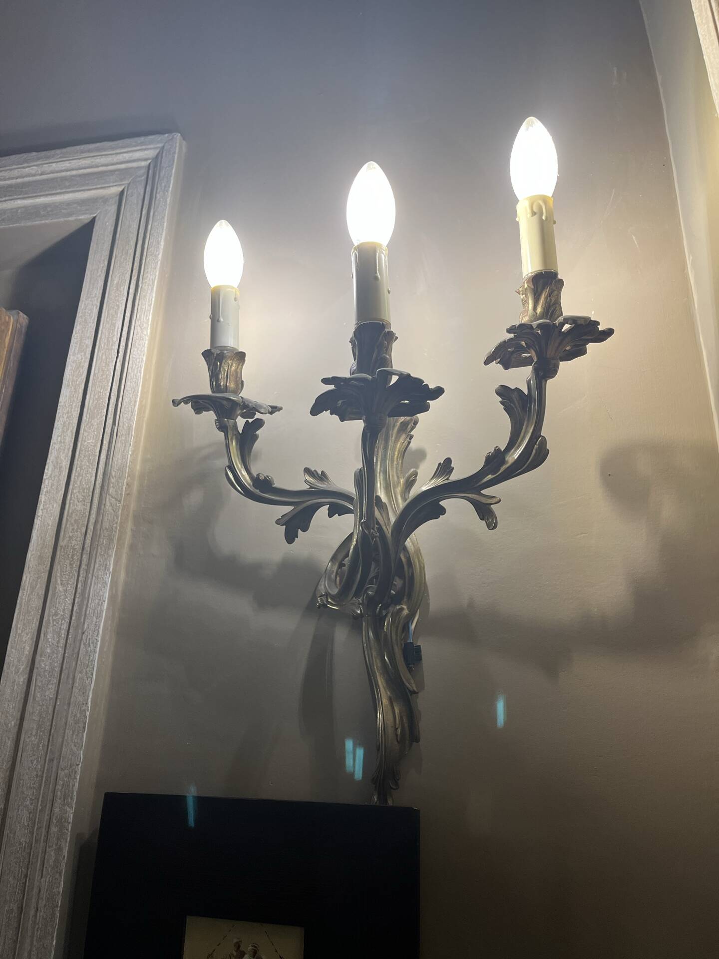 Pair of Louis XV style wall lights, rocaille with three branches in bronze.