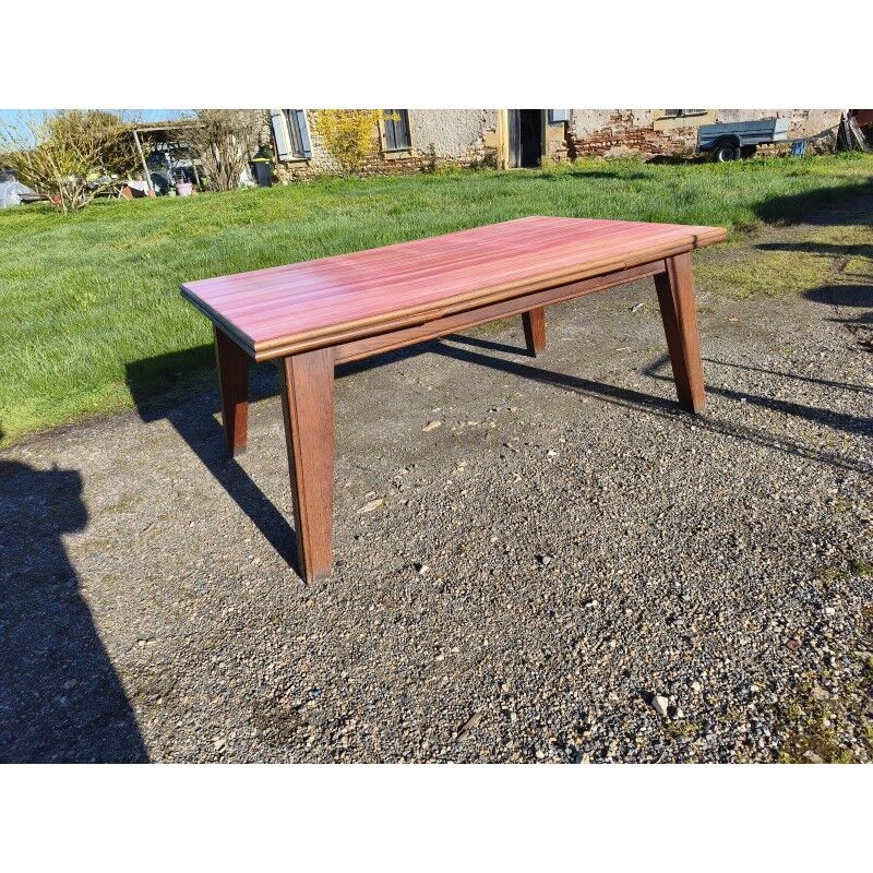 1960s oak dining table with integrated extensions.