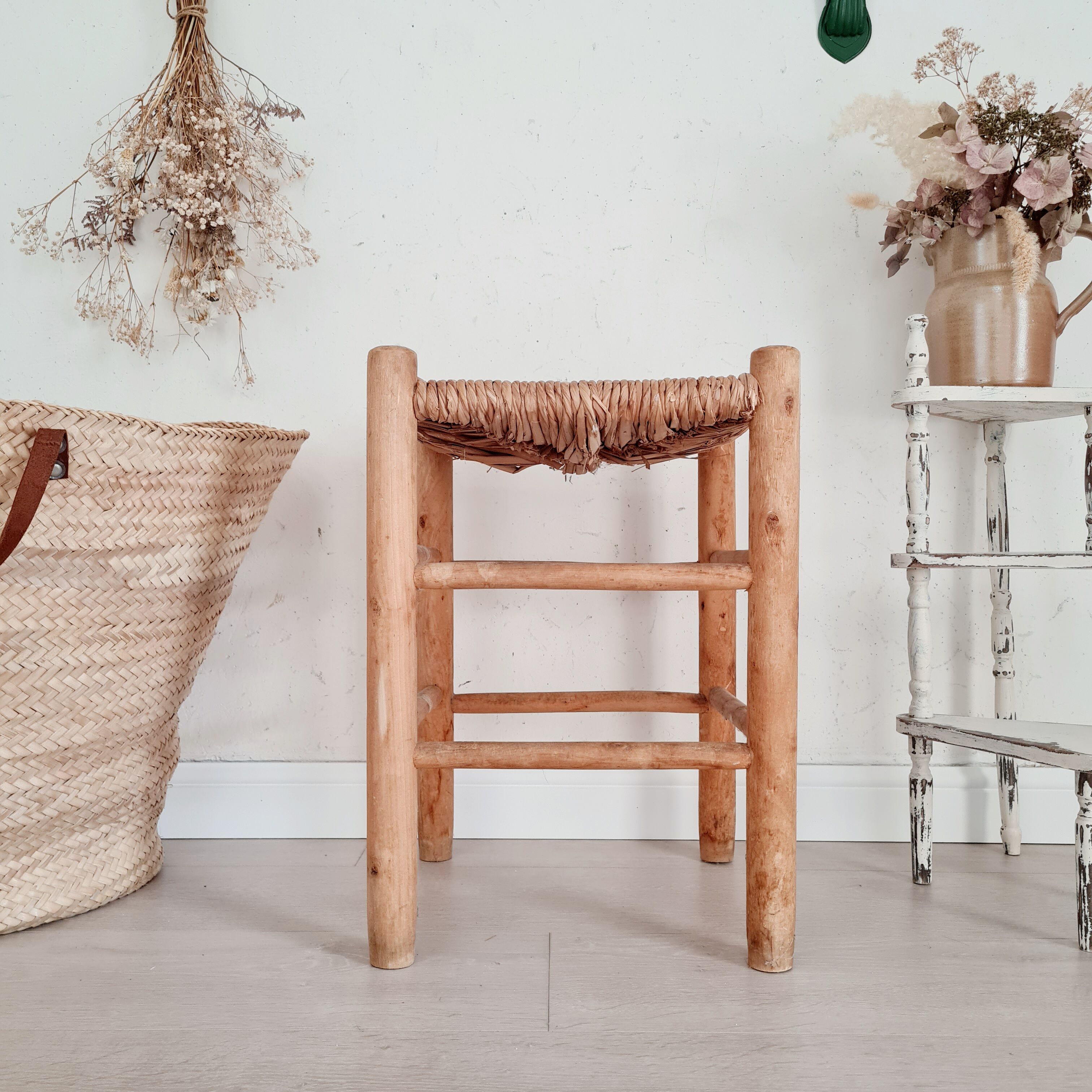 Old stool in wood and straw brutalist look