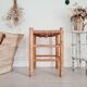 Old stool in wood and straw brutalist look