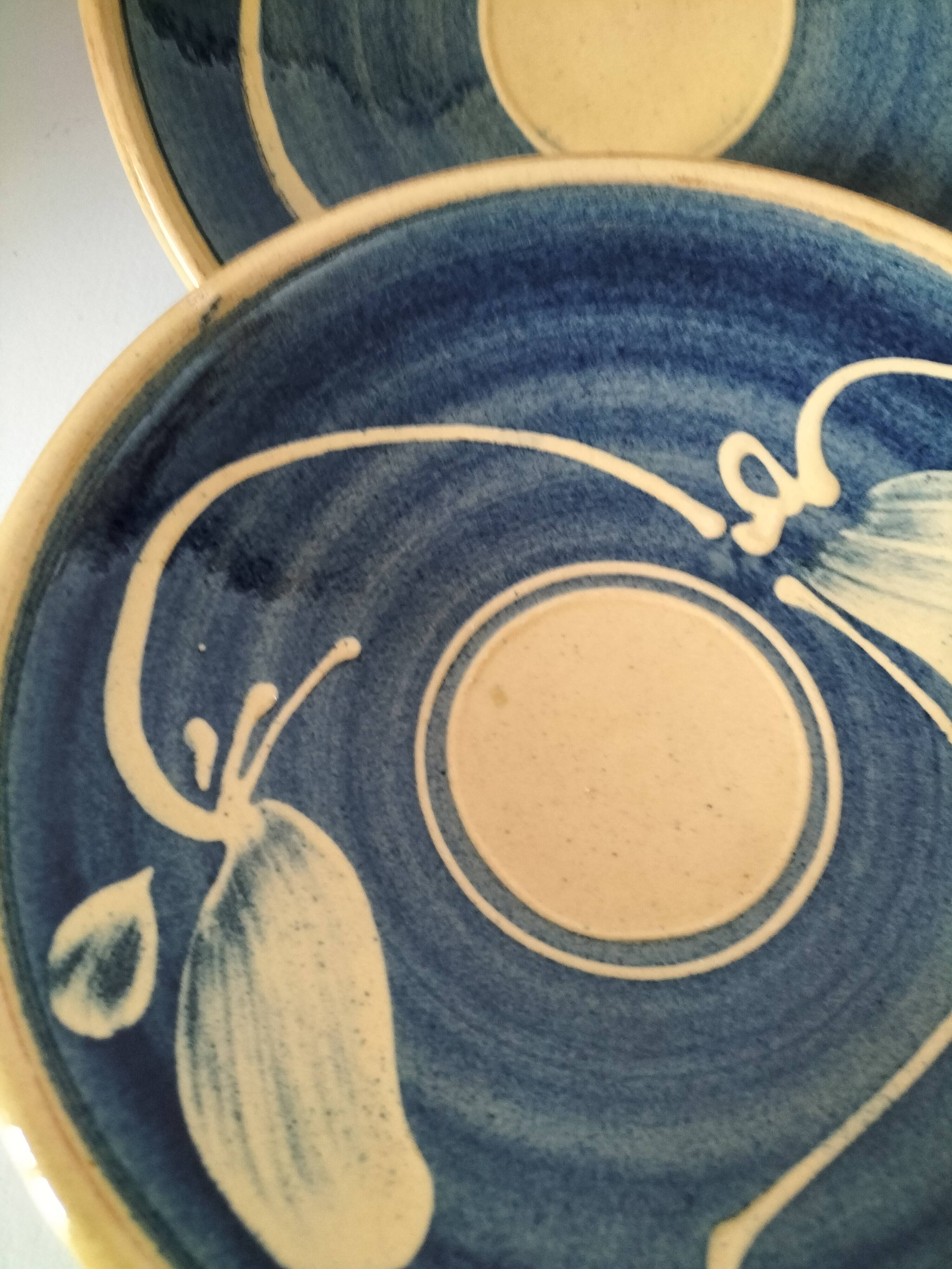 Pair of handcrafted bowls by Le Fer Rouge with blue and beige decor