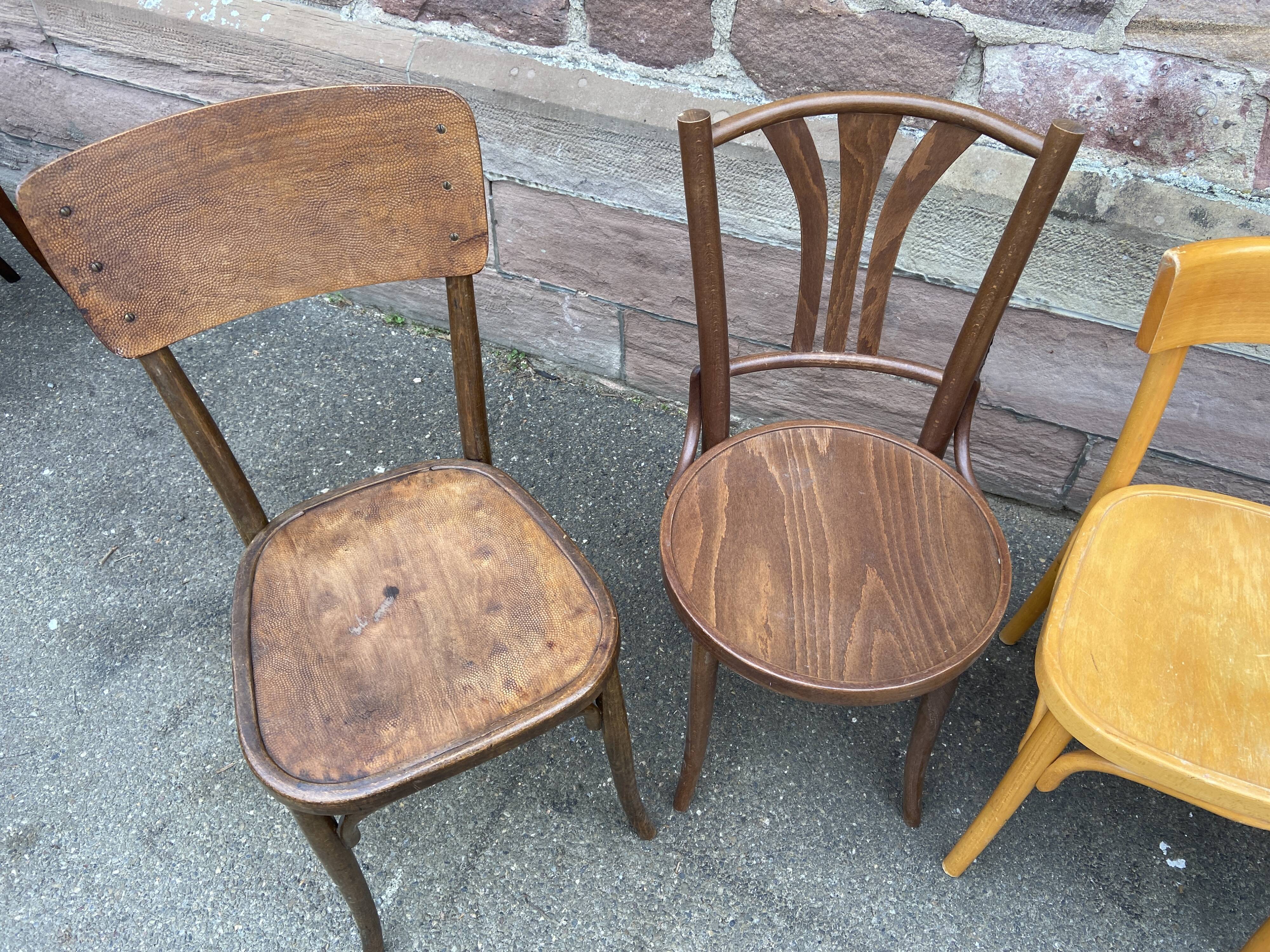Lot 6 mismatched wooden bistro chairs