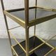Small rolling trolley in brass and black plastic
