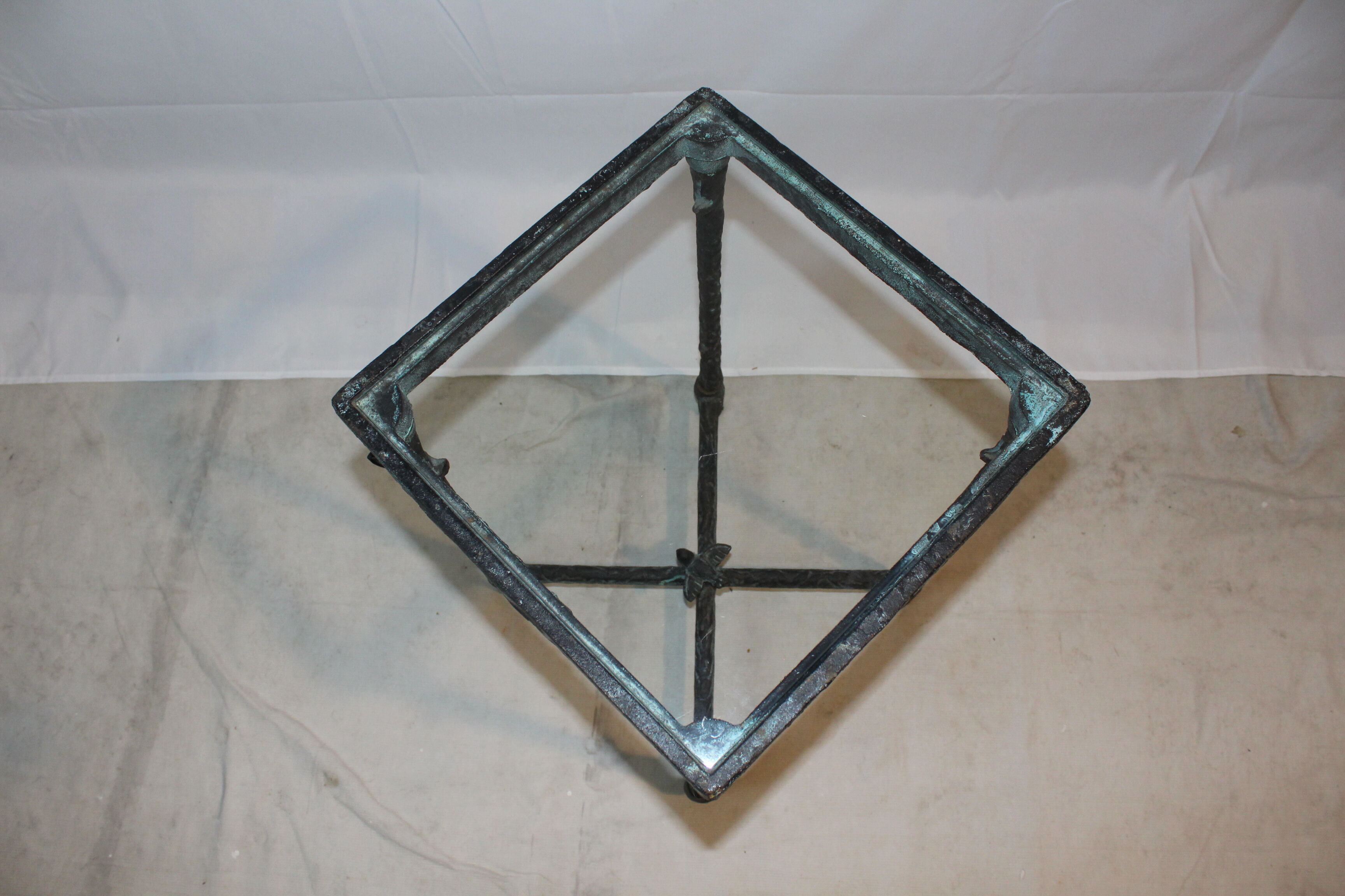 Giacometti style cast iron table, glass table