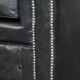 Black Chesterfield armchair made of grained cowhide leather