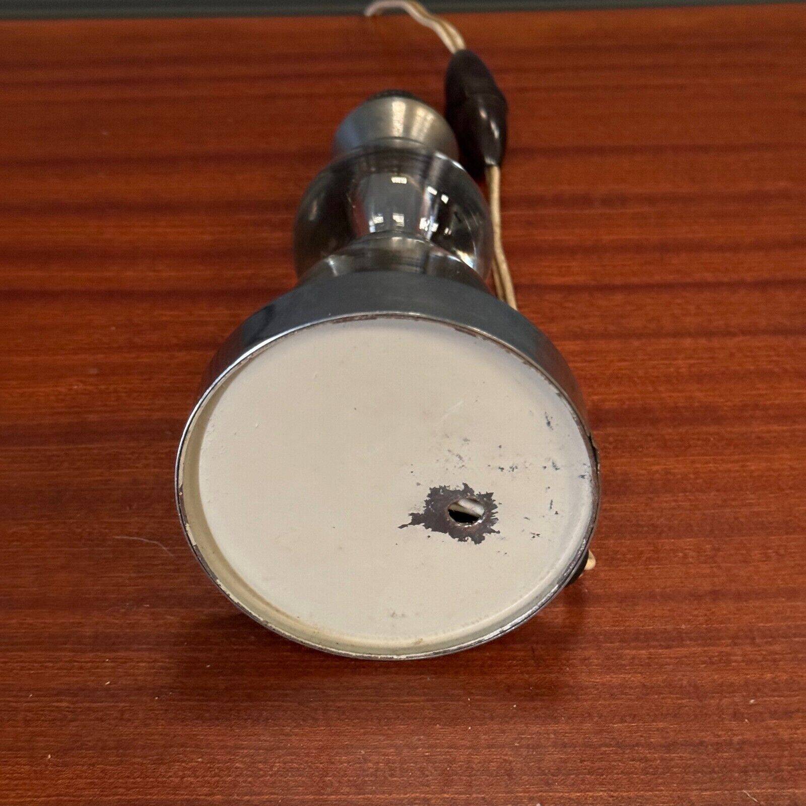 1950s lamp made up of two glass balls and a stainless steel base