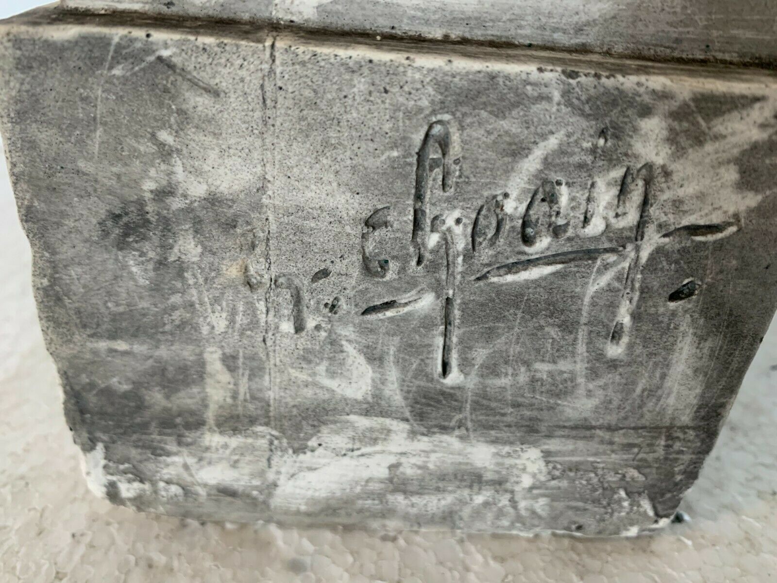 Bust of a young man in plaster signed Gerard Choain XX century