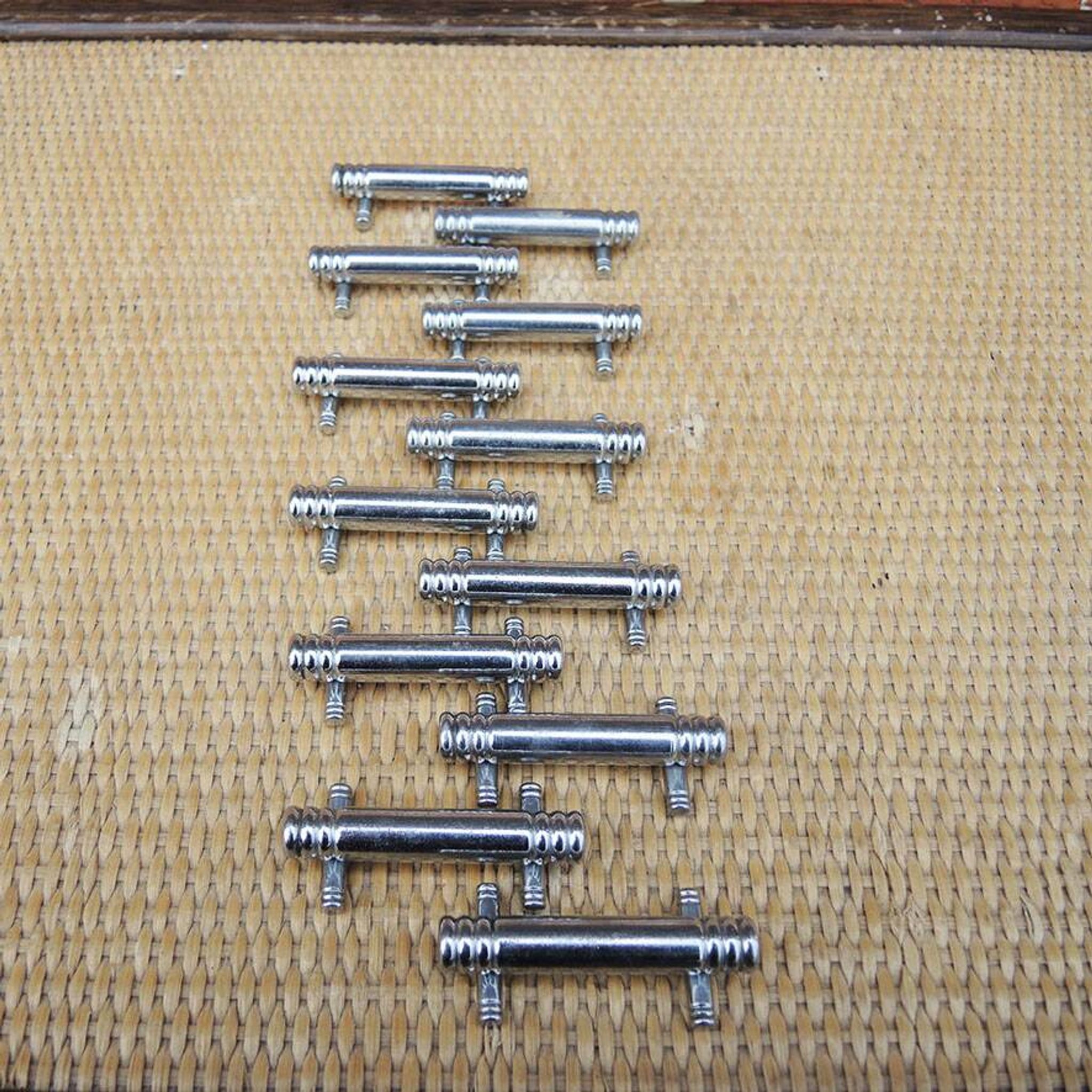 12 vintage Art Deco metal knife rests