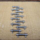 12 vintage Art Deco metal knife rests