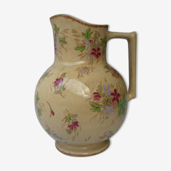 Antique pitcher decorated with flowers