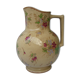 Antique pitcher decorated with flowers