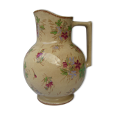 Antique pitcher decorated with flowers