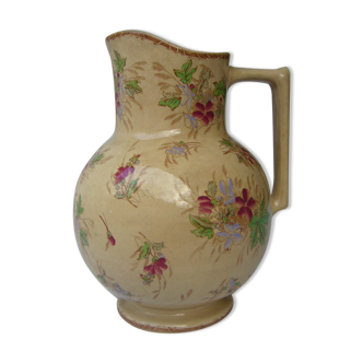 Antique pitcher decorated with flowers