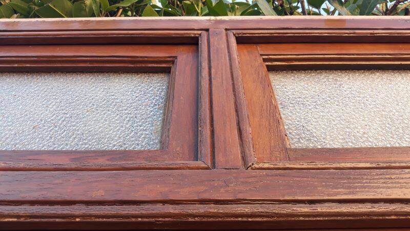 Front door and its frame, translucent glass windows, early 20th century