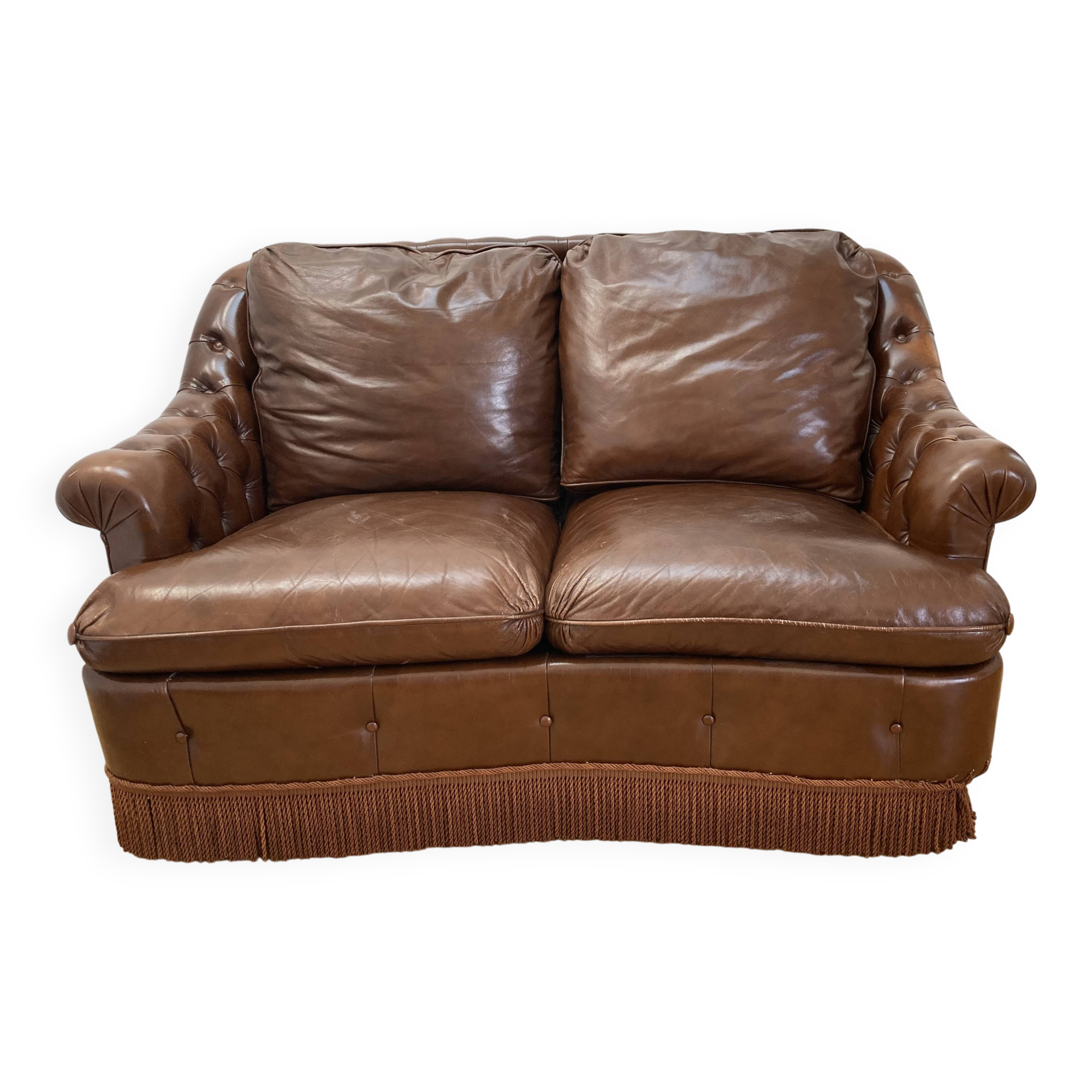 Chesterfield leather sofa with fringes