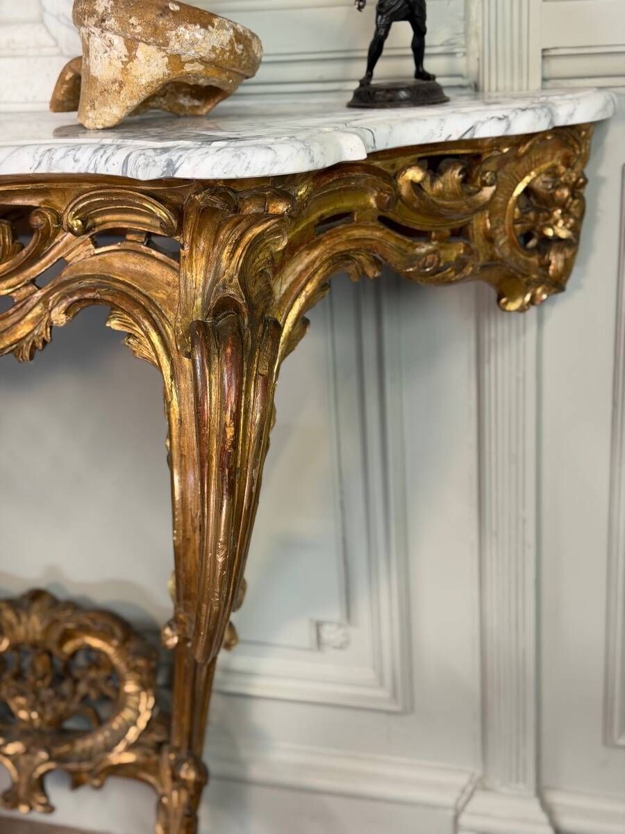 Louis XV style console in carved and gilded wood, circa 1880.