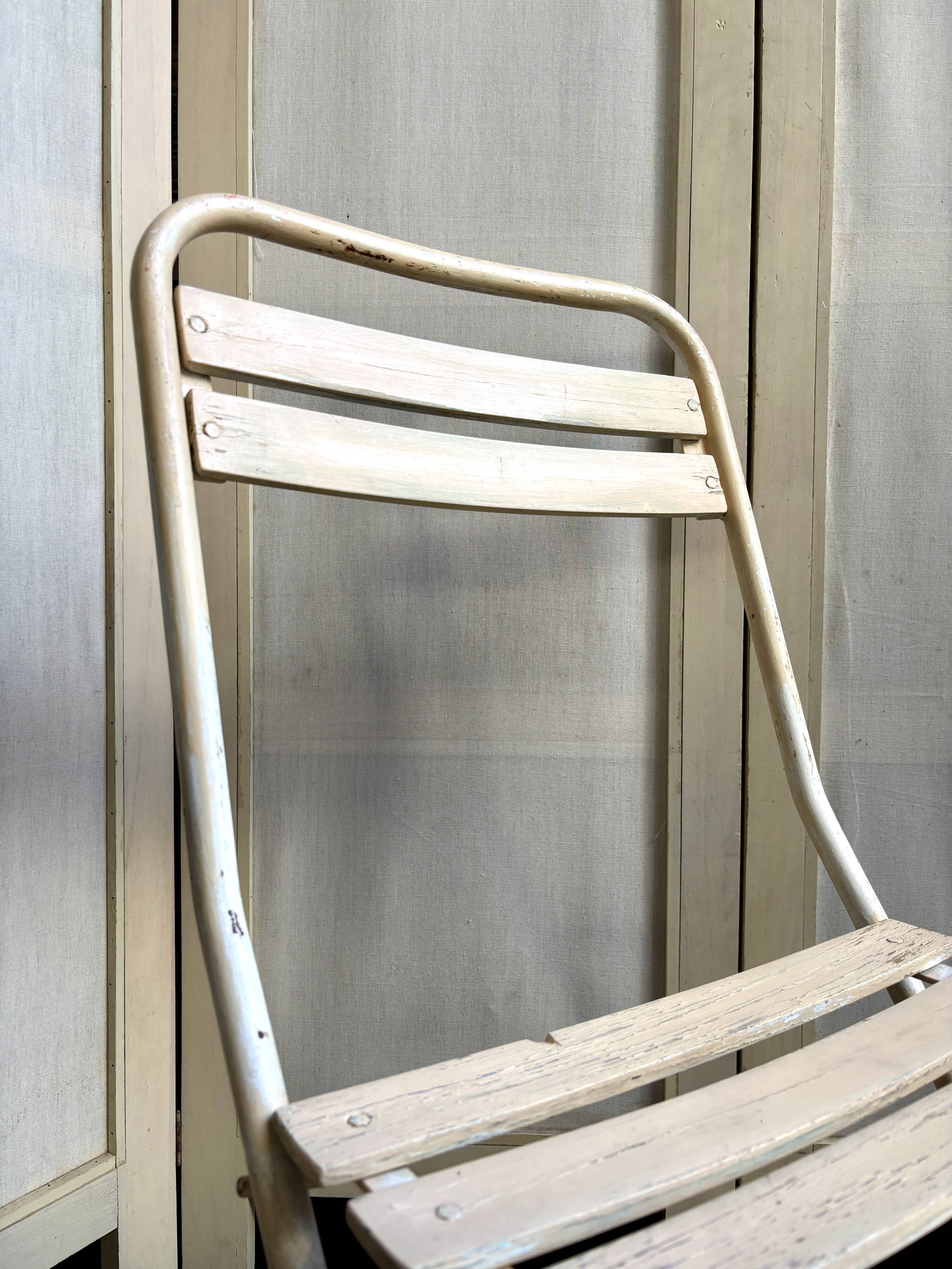 Beige wooden and metal folding chair