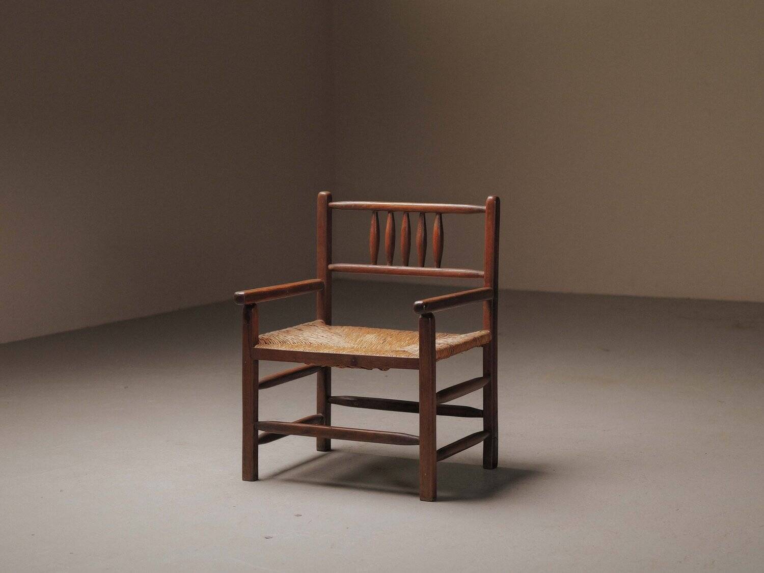 Wicker armchair in solid wood, handcrafted, France, around 1950.