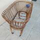 Vintage rattan bed on wheels cradle